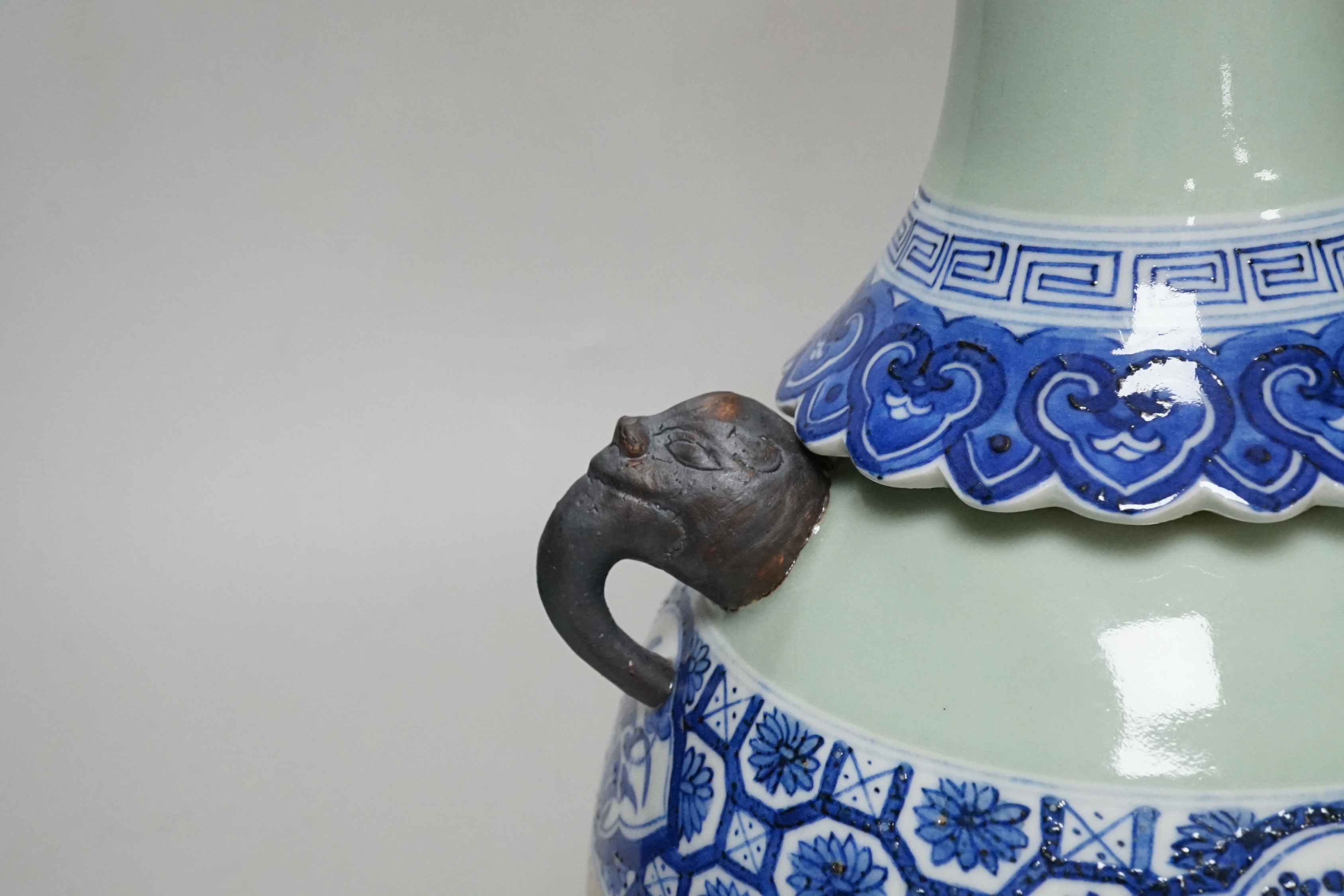 A Chinese celadon and underglaze blue two handled vase, 33cm tall